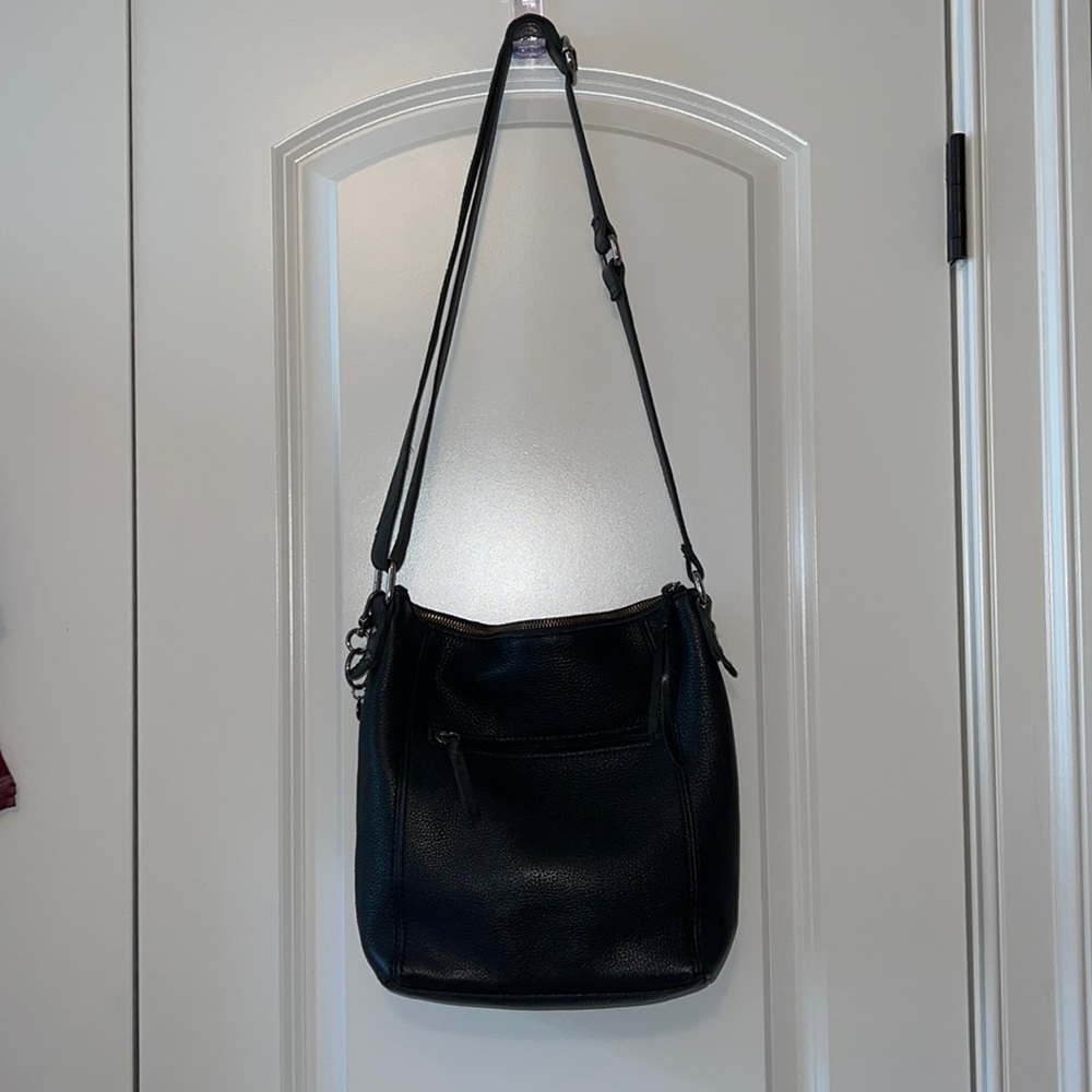 The Sak black leather medium crossbody or shoulder handbag.